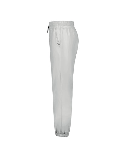 Pantalon - Under Armour gris clair, coupe droite, taille et chevilles élastiquées, poche latérale, vue de profil