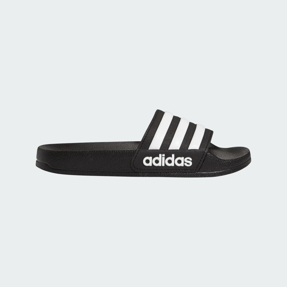 Adidas Adilette Shower sandals for kids, featuring a comfortable slip-on design and classic three-stripe branding.