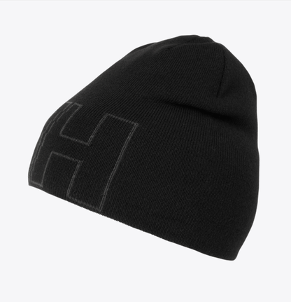 Tuque d'hiver - Helly Hansen noire en maille, design simple avec logo ton sur ton, vue de côté.