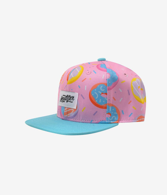 Casquette - Headster rose et bleue avec motifs colorés, logo sur le devant, pour enfant, vue de profil droite.