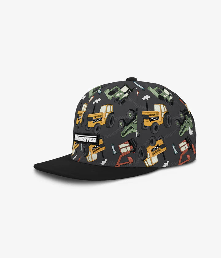 Casquette - Headster noire et grise avec motifs véhicules multicolores pour garçon, tissu polyester et coton, vue de profil gauche.