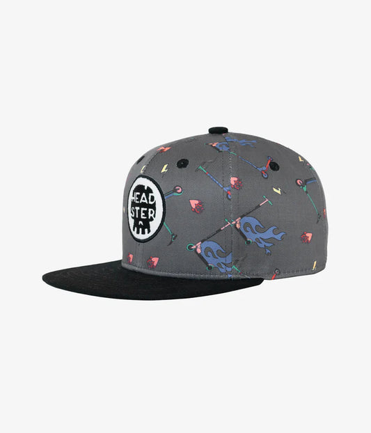 Casquette - Headtser Kids grise avec motifs colorés et visière noire, patch logo blanc noir, style enfant, vue de profil droit.