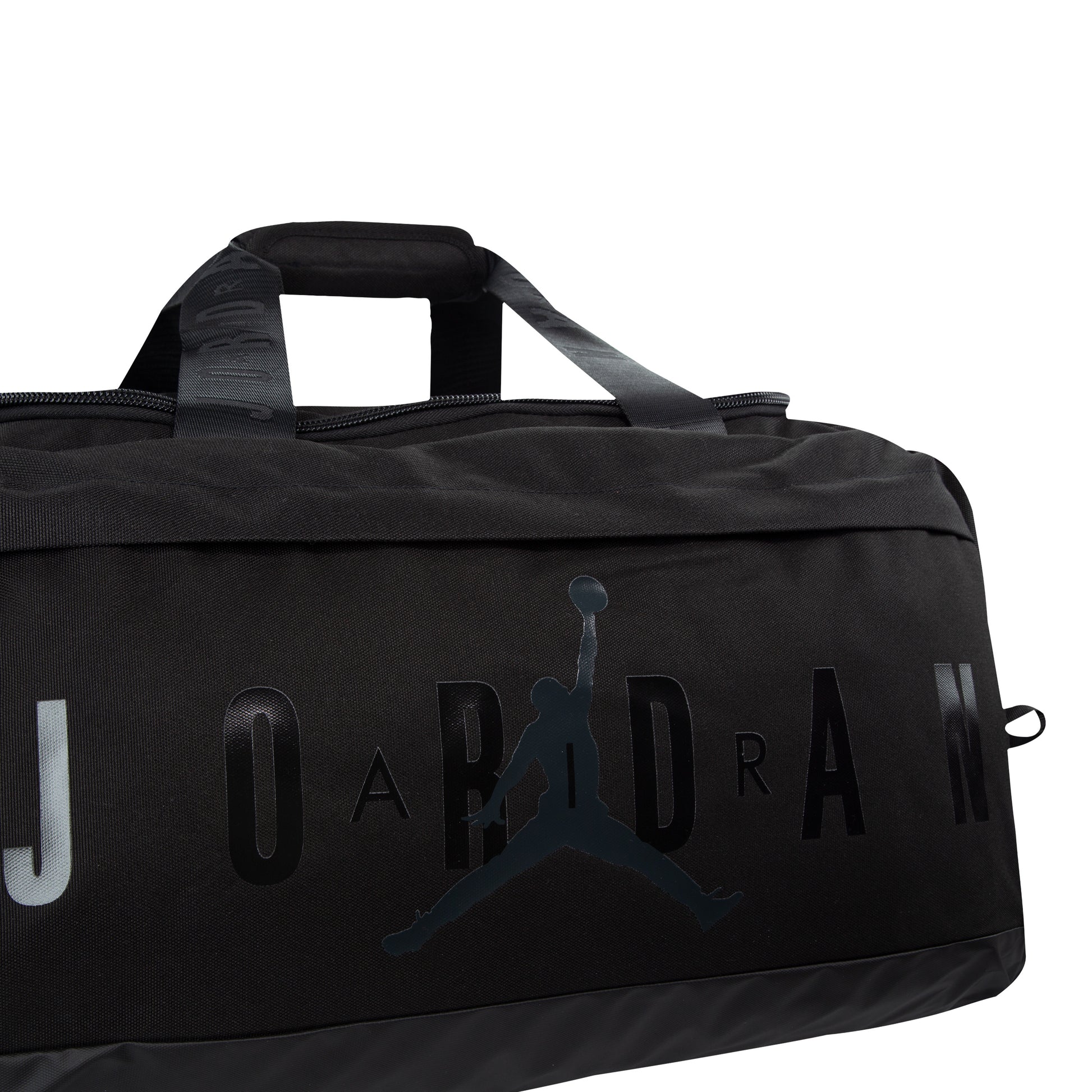 Sac sport - Jordan noir avec logo Jumpman noir brillant et poignées larges, vue gros plan du dessus côté face.