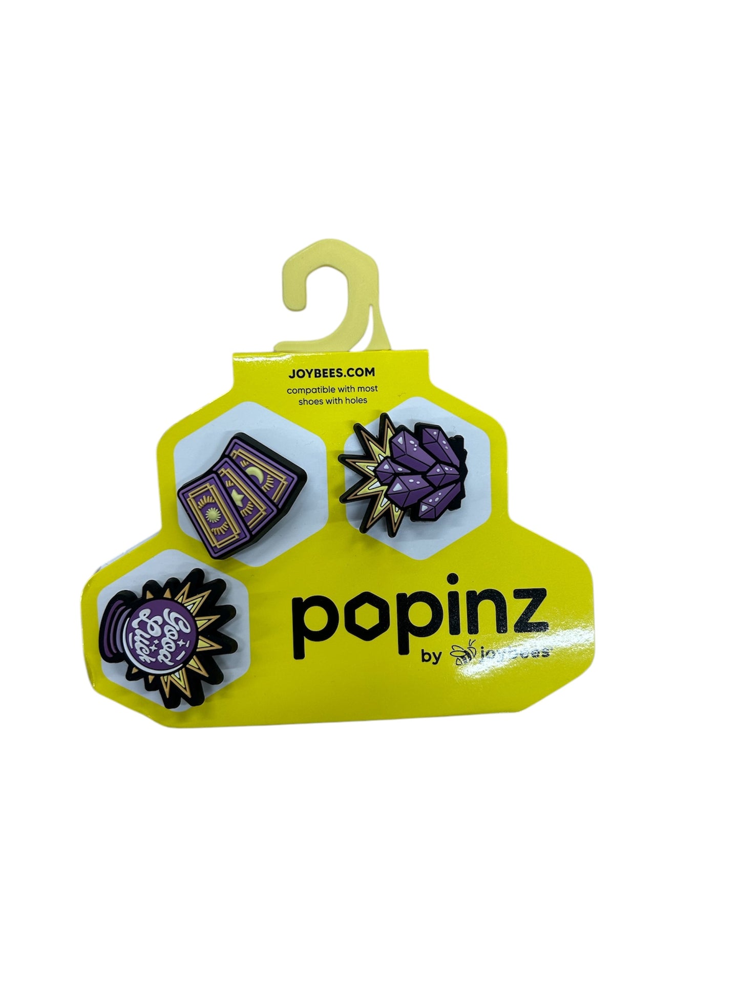 Accessoires Popinz - Joybees multicolores en plastique rigide, style pins décoratifs, présentation sur support jaune, vue de face.