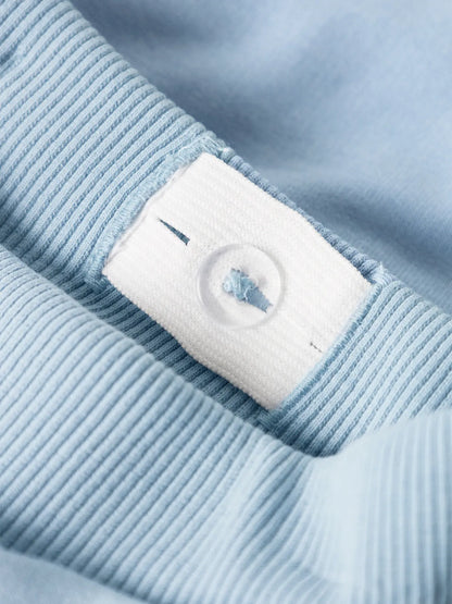 Pantalon - Name It bleu clair en coton et polyester avec détail bouton ajustable, pour fille et garçon, vue gros plan taille intérieur