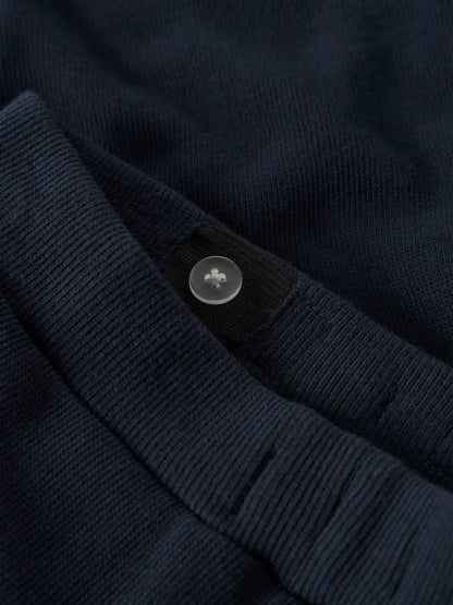 Pantalon - Name It bleu marine en coton bio avec réglage taille par bouton, pour garçon, vue gros plan ceinture