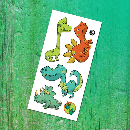 Pico Tatoo - Les dinos, tatouages temporaires colorés vert, bleu, orange, style cartoon pour enfant, vue de face sur feuille blanche.