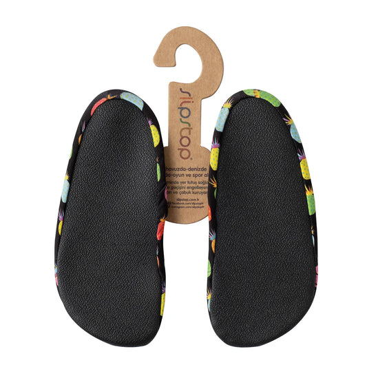 Slip Stop chaussures d'eau noires avec motifs fruits colorés multicolores, semelle antidérapante, pour enfant, vue de dessous