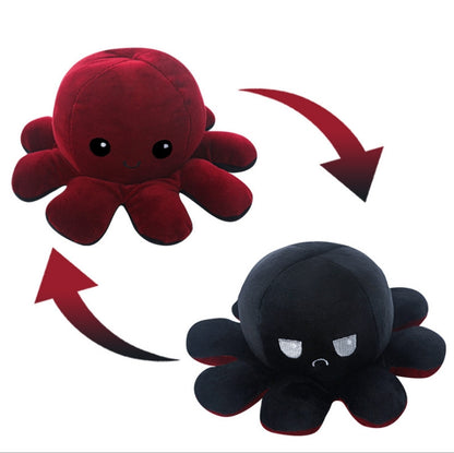 Pieuvre En Peluche Réversible en tissu doux rouge et noire, visage souriant et contrarié, pour enfant, vue de face.