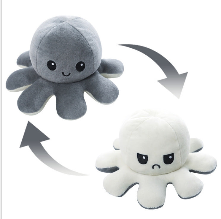 Pieuvre En Peluche Réversible gris et blanche en tissu doux, expressions joyeuse et fâchée, vue de face, enfant.