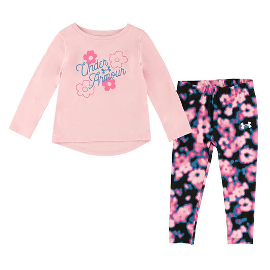 Ensemble - Under Armour fille avec haut rose à fleurs et logo bleu, legging noir à motifs floraux roses, vue de face.