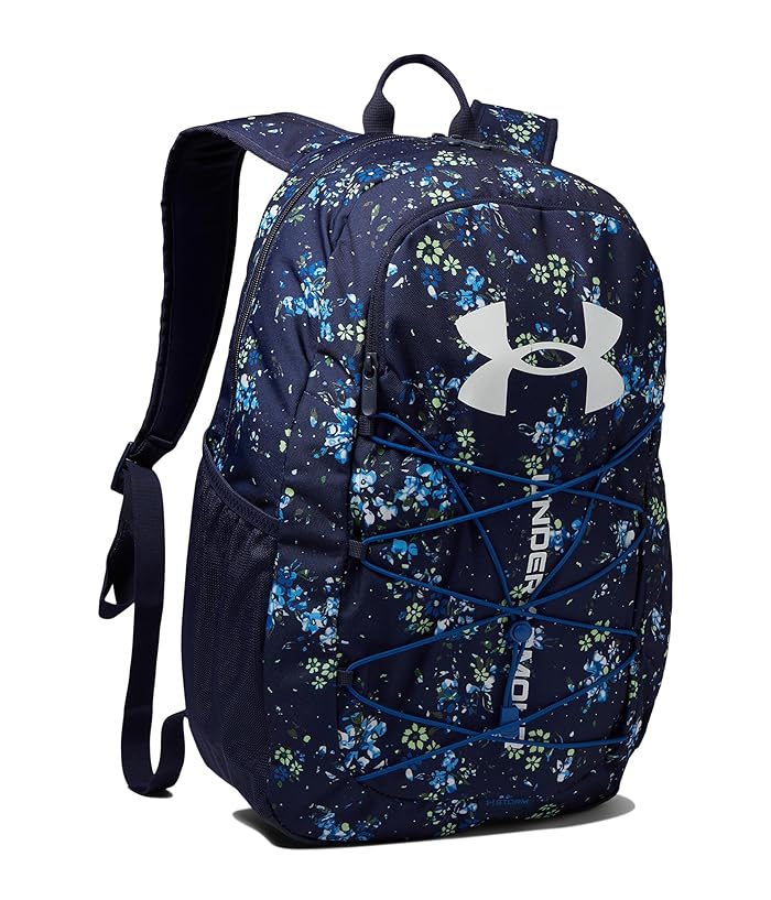 Sac à dos - Under Armour bleu marine à motifs floraux bleus et verts, poches latérales filet, vue de profil droit.