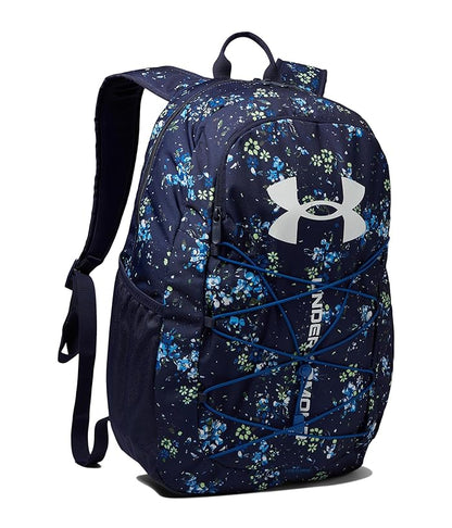 Sac à dos - Under Armour bleu marine à motifs floraux bleus et verts, poches latérales filet, vue de profil droit.