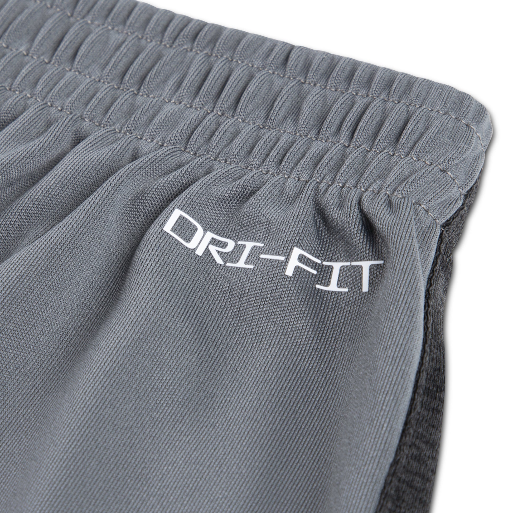 Détail d'ourlet gris anthracite en polyester avec inscription DRI-FIT sur ensemble - Nike, vue rapprochée