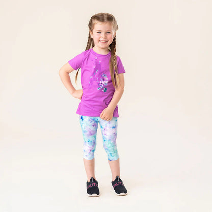 Legging 3/4 - Nanö blanc et bleu avec motifs aquarelles, porté par une fille, vue de face.