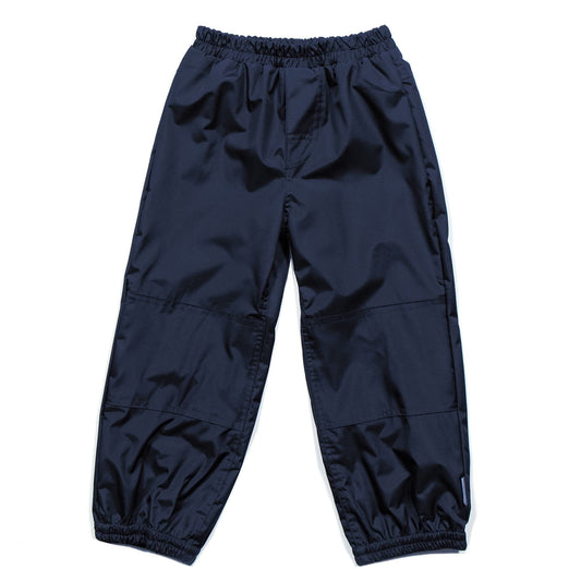 Pantalon d'extérieur - Nanö marine en tissu technique, coupe ample avec taille et chevilles élastiquées, vue de face pour enfant.