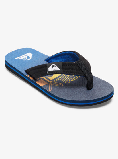 Sandales - Quiksilver bleu et noir en textile et caoutchouc, style gougounnes, vue de côté sur fond blanc.