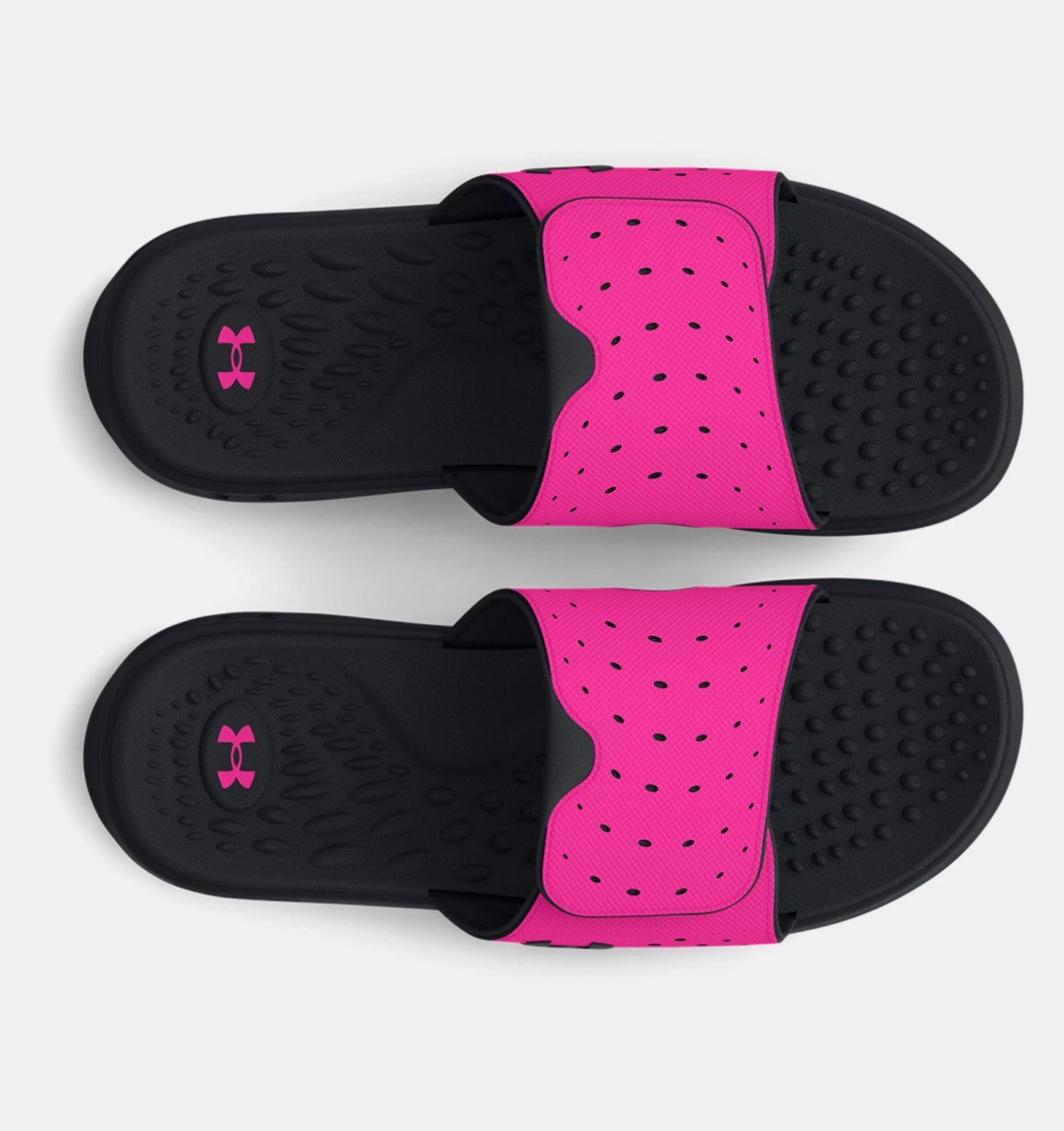 Sandales - Under Armour slides noires et roses avec strap perforé, semelle texturée, pour fille, vue de dessus.